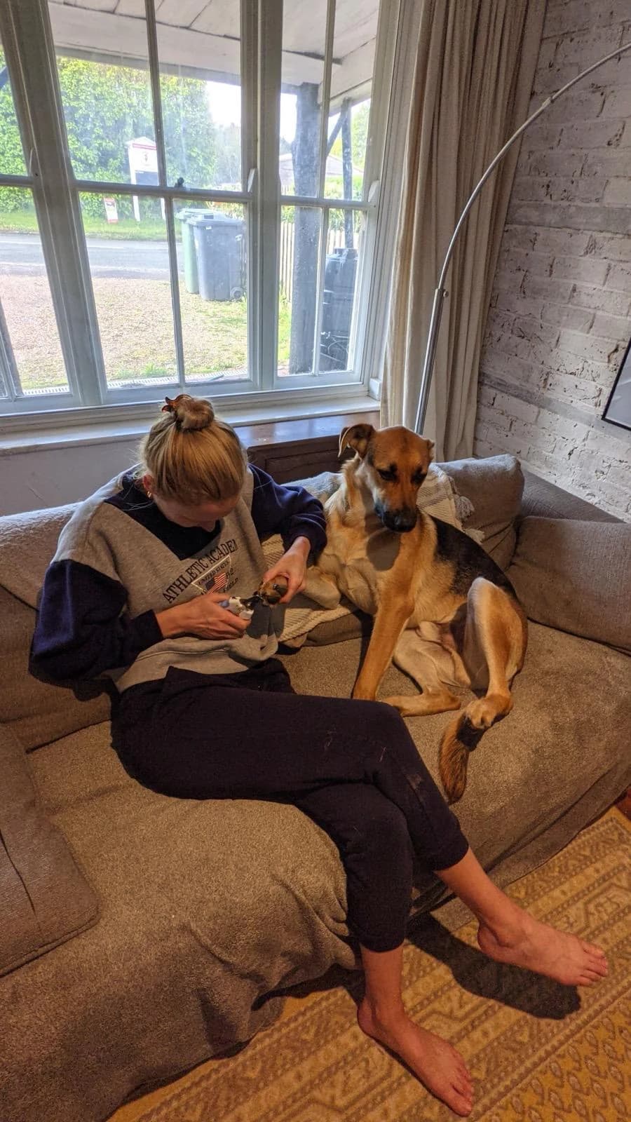 Lorna at home with Django on the sofa